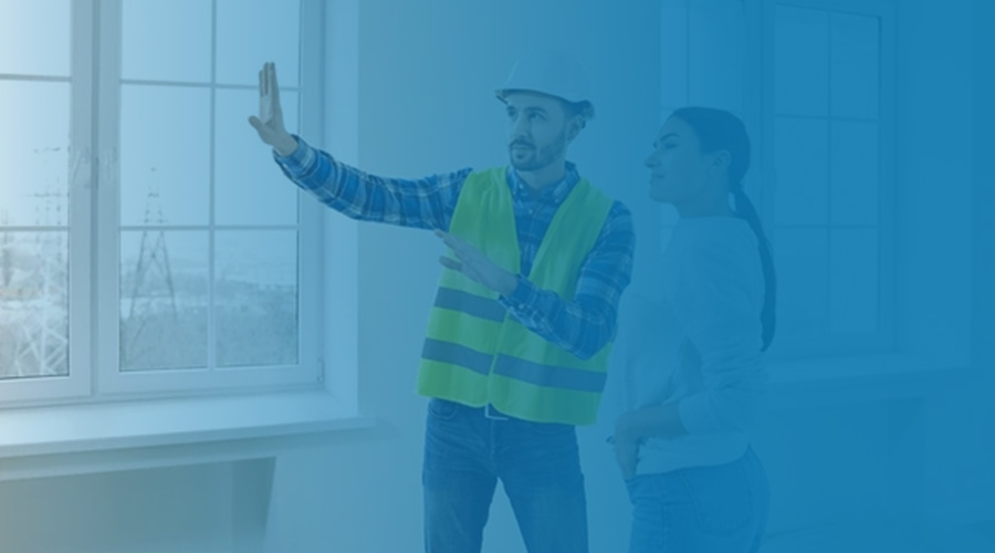 Man shows woman vision of housing construction