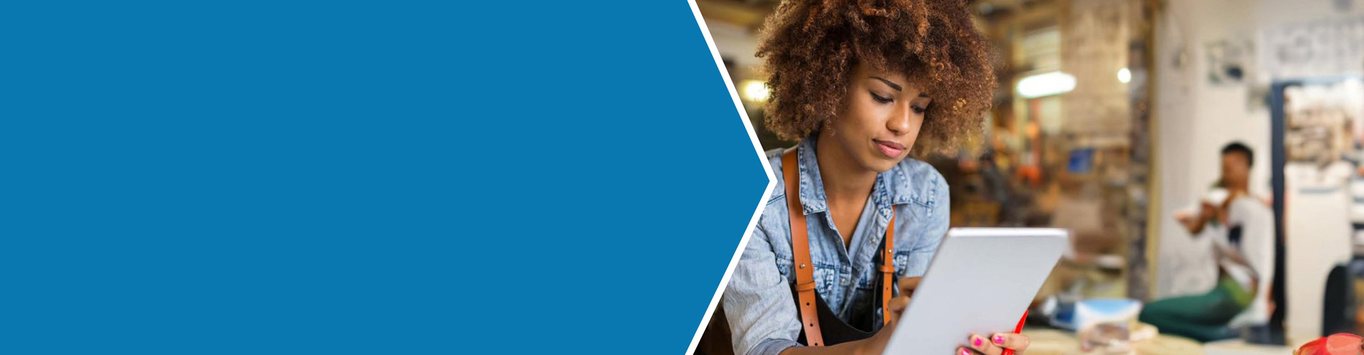 Woman accepts credit card payment at her small business